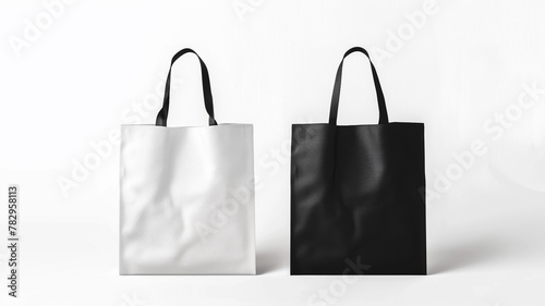 Set of tote bags mockup black and white isolated on white background © Yuwarin