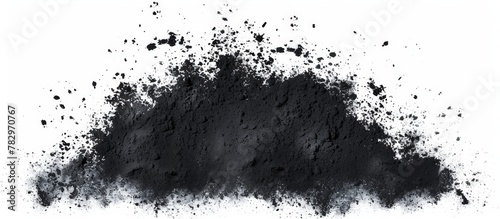 Close-up image of a concentrated heap of black powder set against a plain white backdrop