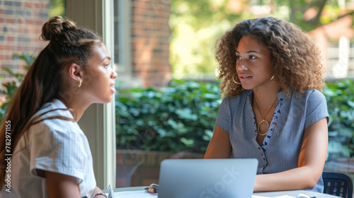 Student consulting with mentor, academic advising and learning in progress. photo