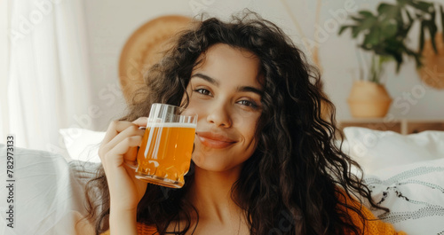 Happy and smiling young woman enjoying drinking Kombucha drink at modern home. Healthy natural probiotic drink. Generative ai