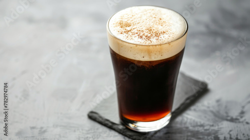 Product photo of nitro cold brew coffee, on slate surface, isolated on white background. studio lighting.