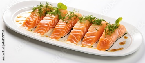 Four salmon portions on plate with sauce