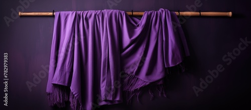 Purple scarf on wooden pole...