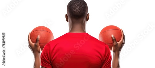 Man holding two basketballs