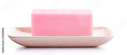 Pink soap bar on small plate