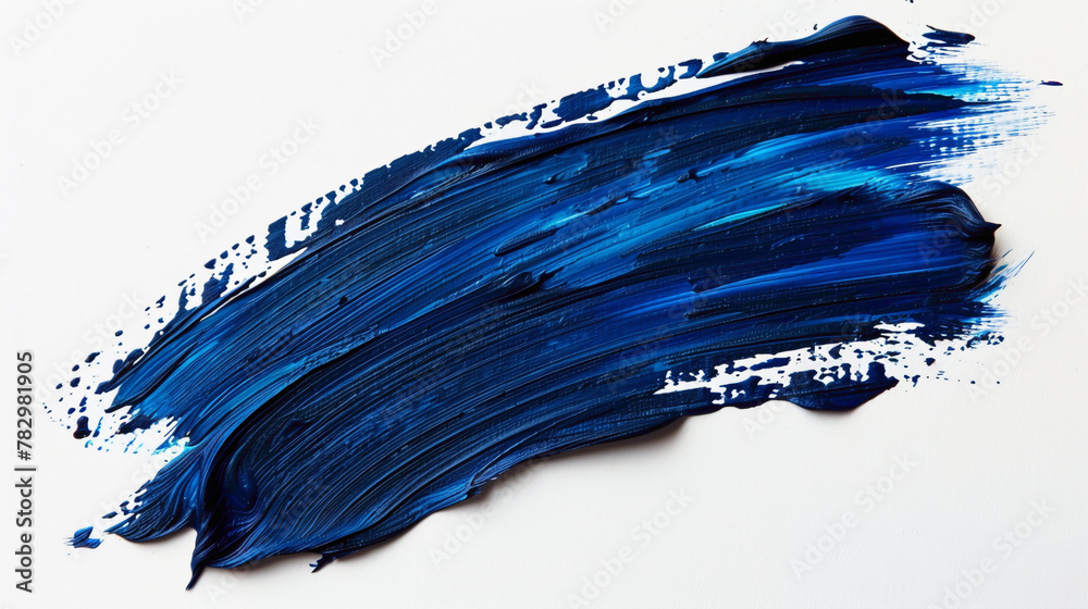 Indigo blue paint brush stroke on a pure white background