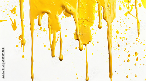 Golden yellow paint drip on a pure white background photo