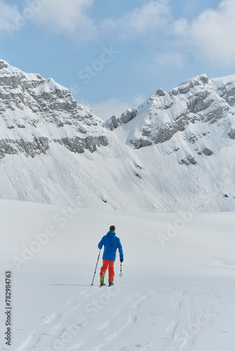 A Skier Scales a Treacherous Alpine Peak © .shock