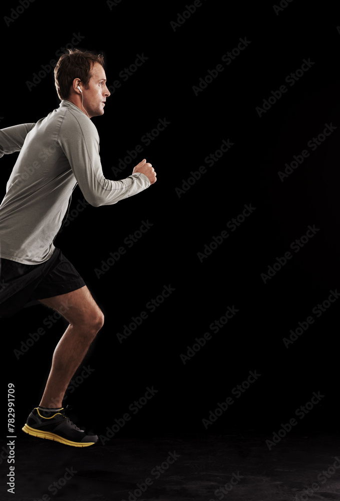 Man, cardio and running exercise in studio for athlete performance or marathon, training or black background. Male person, fitness and sports with mockup space for healthy, workout or competition