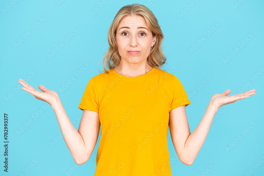 Doubtful woman showing gesture with palms, choice of options Doubtful woman showing gesture with palms, choice of options