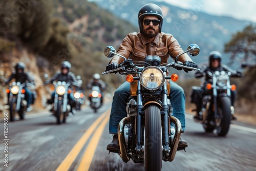 A focused man leads a pack of bikers down a winding road, symbolizing freedom and adventure