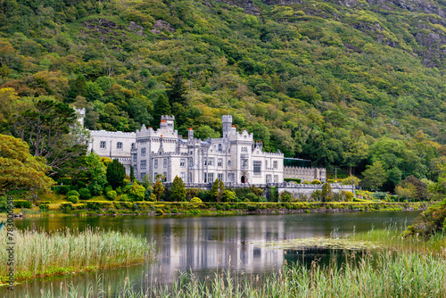 Kylemore Abbey with water reflections in Connemara, County Galway, Ireland, Europe. Benedictine monastery founded 1920 on the grounds of Kylemore Castle. Mainistir na Coille Moire