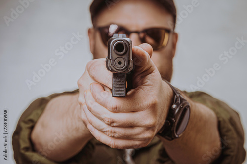 a man aims a gun
