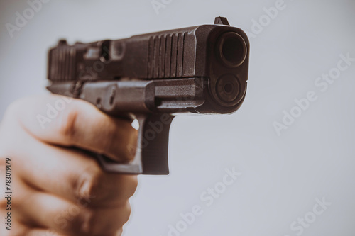 a man aims a gun photo