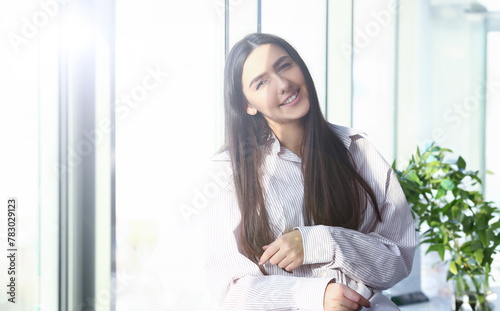Indian woman in male shirt at home portrait bacground