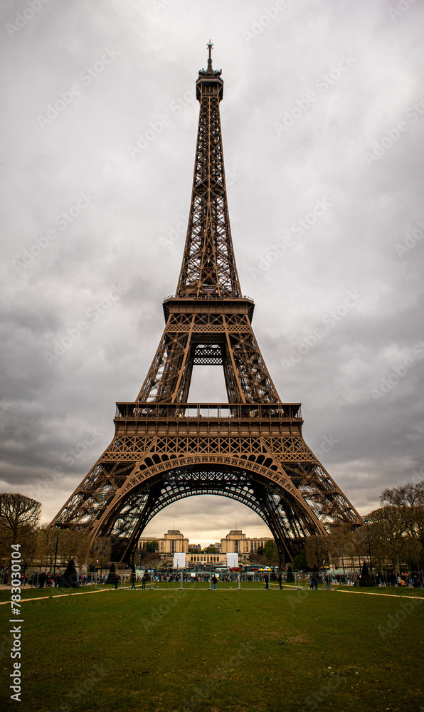 Eiffel Tower from the ground with a grey sky
