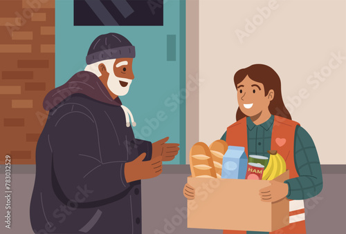 Woman volunteer handing a food container to an elderly homeless man. © rexandpan