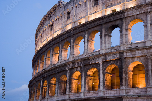 The Colosseum basked in golden sunset light, evoking the grandeur of ancient Rome and the enduring legacy of human civilization photo