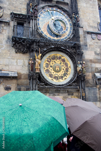A beautiful image of the historic astronomical clock of Prague, the rain adding depth to the age-old timepiece, a blend of art and science photo