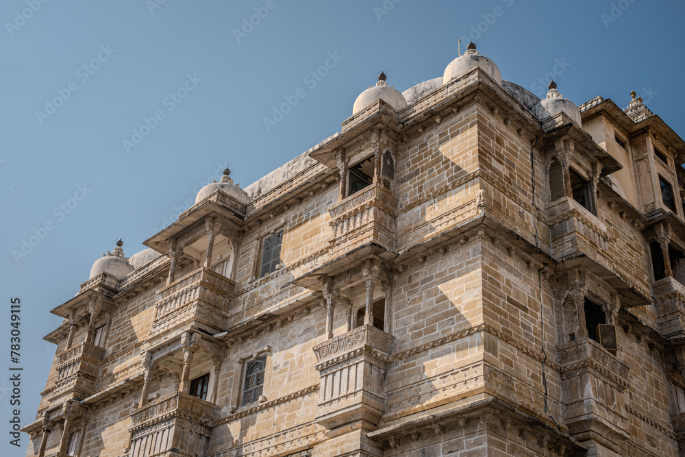 Udaipur, Rajasthan, India 07 April 2024: Shot of the historical exterior of City Palace. The palace was built nearly 400 years ago, with contributions from several rulers of the Mewar dynasty. Udaipur, Rajasthan, India 07 April 2024: Shot of the historical exterior of City Palace. The palace was built nearly 400 years ago, with contributions from several rulers of the Mewar dynasty.