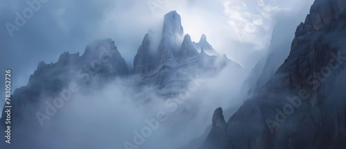 Mountain summit cutting skyward through clouds, sweeping view of surrounding peaks