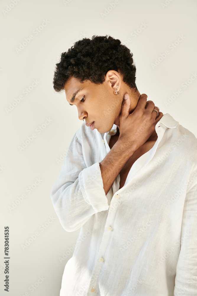 handsome elegant african american man in chic linen clothing looking away on beige backdrop handsome elegant african american man in chic linen clothing looking away on beige backdrop