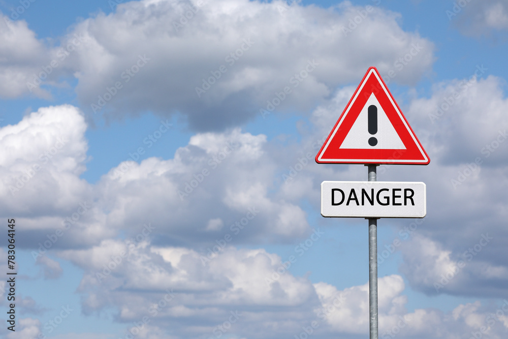A sign with a exclamation mark warning for a dangerous situation ahead and a smaller sign below with the English word danger on it
A sign with a exclamation mark warning for a dangerous situation ahead and a smaller sign below with the English word danger on it