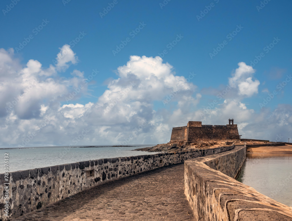 Stunning sea front of the old town of Arrecife, with the ruins of the old castle of San Gabriel in the background, Lanzarote, Canary Islands, Spain