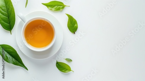 Wallpaper Mural Top view shot of a hot cup of tea with green leaf decoration on white background Torontodigital.ca