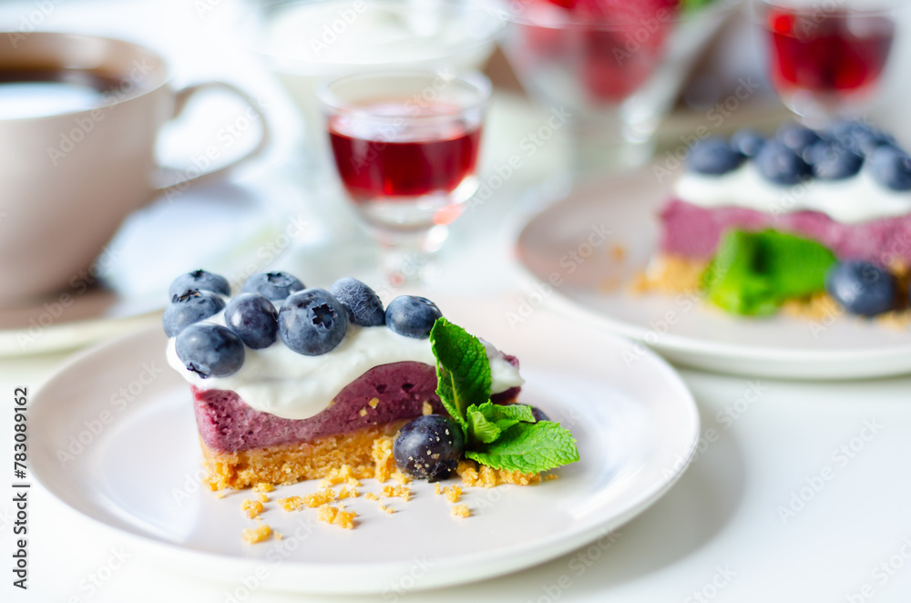 The baked vanilla and berries flavour cheesecake swirled with blueberry sauce on a digestive biscuit crumb The baked vanilla and berries flavour cheesecake swirled with blueberry sauce on a digestive biscuit crumb