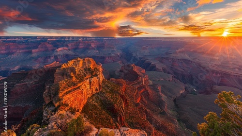 Sunset casts warm hues across the rugged landscape of Grand Canyon National Park illuminating its dramatic depth and vastness