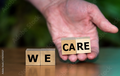 Wooden cubes form the expression 'we care'