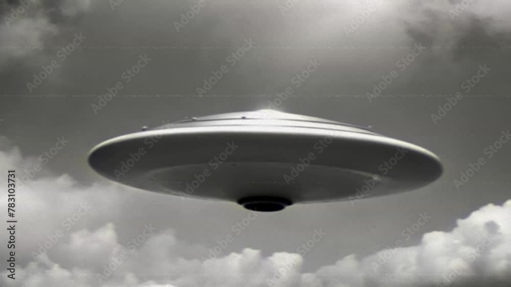 UFO, an alien saucer hovering above the field in the clouds, hovering motionless in the sky. Unidentified flying object, alien invasion, extraterrestrial life, space travel, spaceship. black and white UFO, an alien saucer hovering above the field in the clouds, hovering motionless in the sky. Unidentified flying object, alien invasion, extraterrestrial life, space travel, spaceship. black and white
