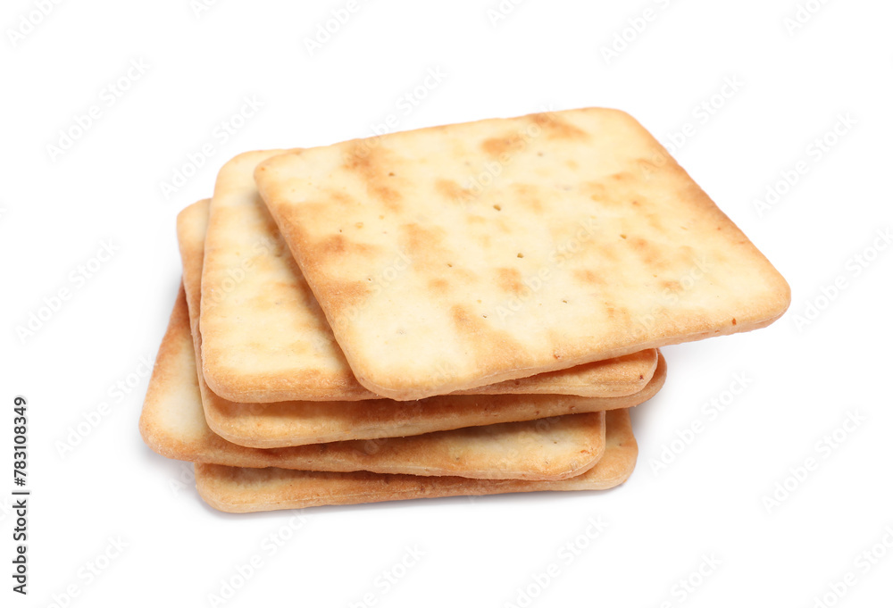 Fototapeta premium Tasty crispy square crackers isolated on white