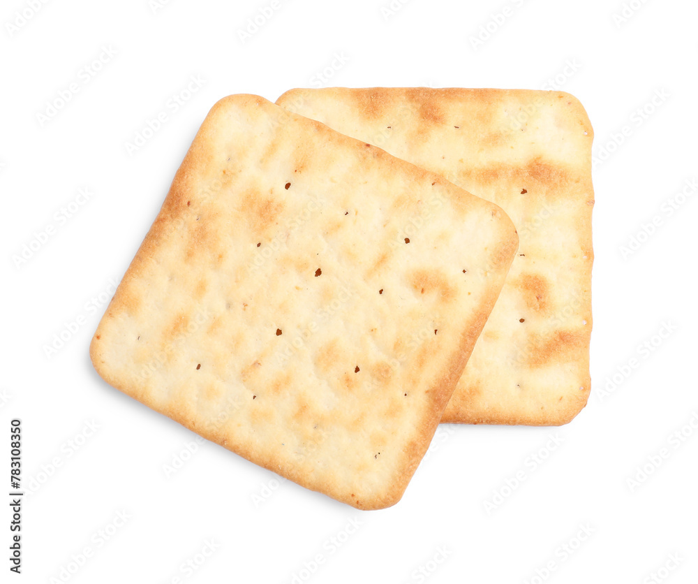 Tasty crispy square crackers isolated on white, top view Tasty crispy square crackers isolated on white, top view