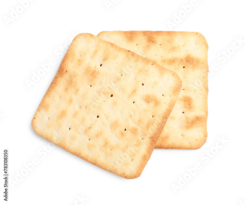 Tasty crispy square crackers isolated on white, top view