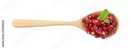 Ripe juicy pomegranate grains and leaves in wooden spoon isolated on white, top view