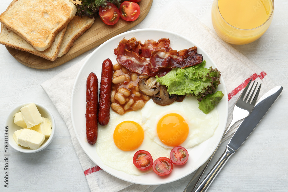 Delicious breakfast with sunny side up eggs served on white table, flat lay Delicious breakfast with sunny side up eggs served on white table, flat lay