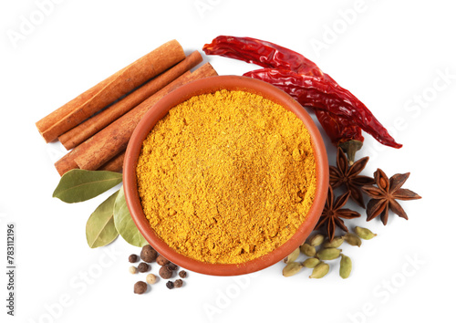 Fototapeta Naklejka Na Ścianę i Meble -  Curry powder in bowl and other spices isolated on white, top view