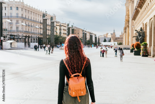 Fotografie Tourist unrecognizable walking through the Plaza del Pilar in the city of Zarago
