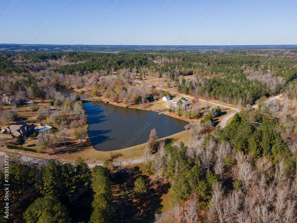 Aerial landscape of forest and pond in rural neighborhood in Grovetown Augusta Georgia