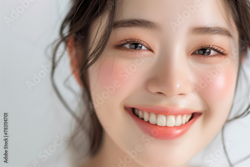 Beautiful Asian teenager in korean style makeup on white background. Copy space. Closeup