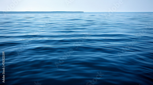 The ocean is calm and blue, with no visible waves