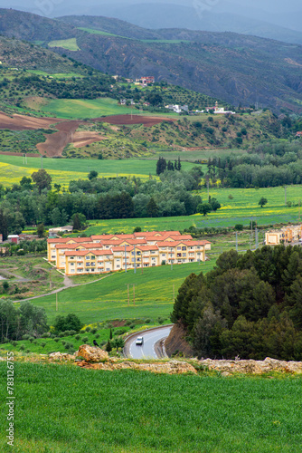 Scenic view of a field and houses in a village in Setif, Algeria.