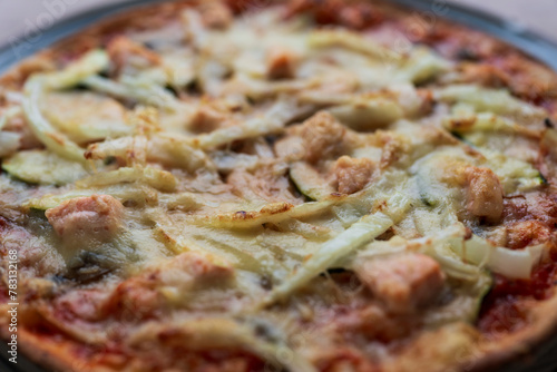 Italian homemade pizza with salmon and onions and parmesan, Italian cooking