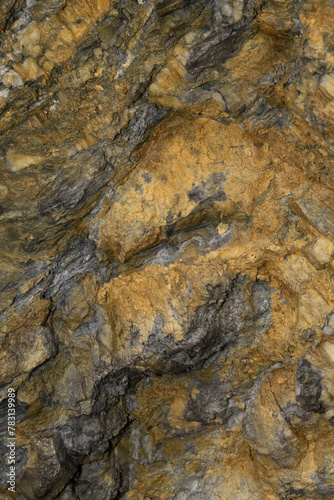 A close up shot of an rustic orange rock.
