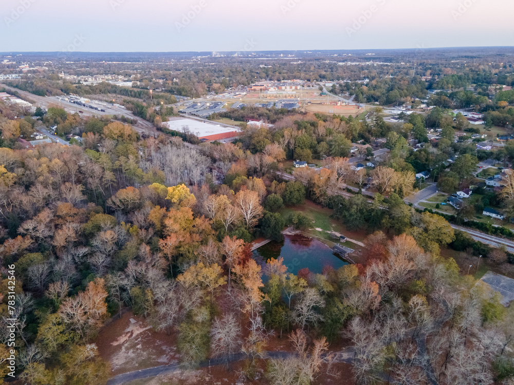 Aerial landscape of forest pond and Pendleton King Park at sunset in Augusta Georgia