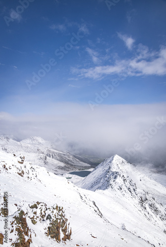 View from Piz Nair, overlooking snow-covered mountains and Lake Suvretta (Lej Suvretta), near St Moritz, Switzerland
