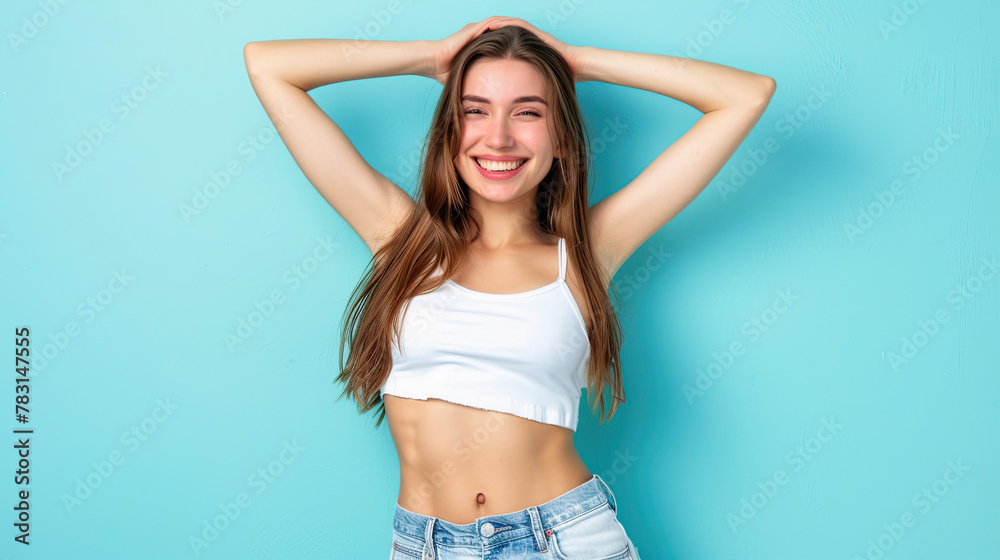 Portrait of a happy young girl celebrating success on pastel blue background Portrait of a happy young girl celebrating success on pastel blue background