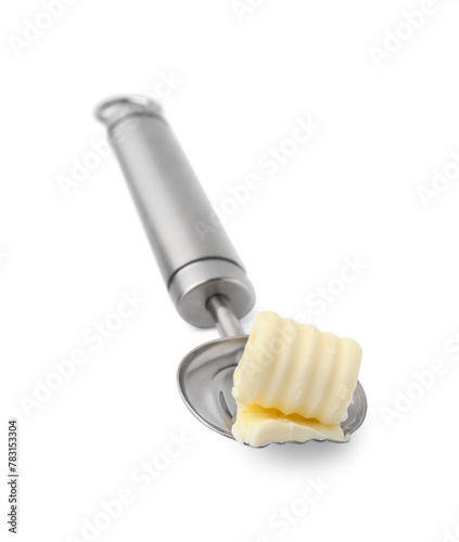 Butter curl in spoon isolated on white